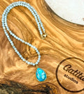 Opaque aquamarine necklace with turquoise pendant