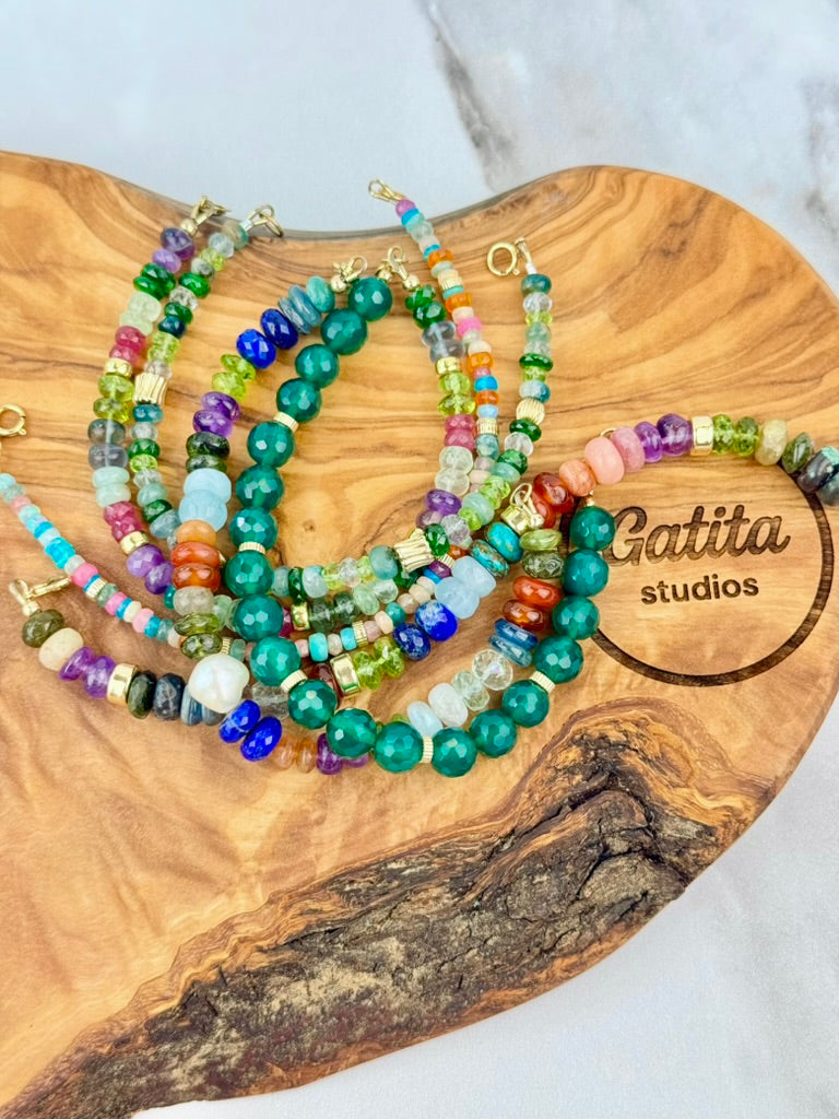 Multi gemstone bracelet with centered pearl