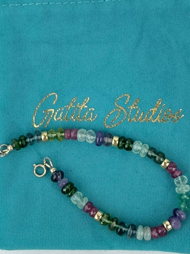 Multi-gemstone bracelet with smooth rondelles